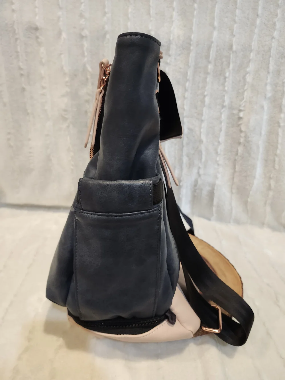 Petunia Pickle Bottom navy blue diaper bag with rose gold accents